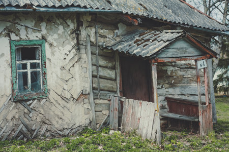 Close up broken rural house porch concept photo. Old abandoned farmhouse. Front view photography with blurred background. High quality picture for wallpaper, travel blog, magazine, articleの写真素材