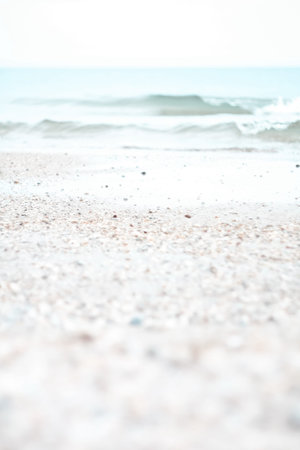Close up white sand beach and ocean waves concept photo. Tropical resort. Front view photography...