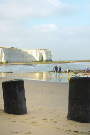  walking on the beach by the chalk cliffs of Kingsgate Bay, Kent.