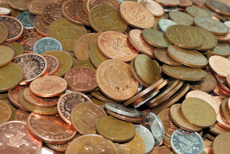 Closeup view of low value UK coins in a pile                                  