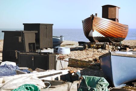 A boat that is being restored on a beachの写真素材