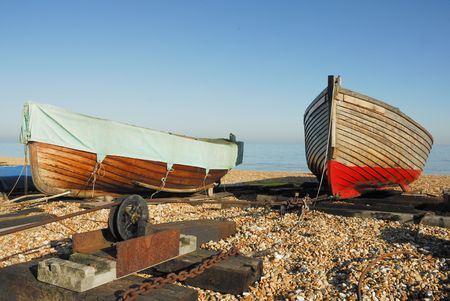 Two large sea going rowing boats on a pebbled beachの写真素材