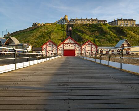 Saltburn by the Sea pier looking towards the Cliff Lift which dates from 1884 and is one of the world's oldest water-powered funicular railways.の写真素材