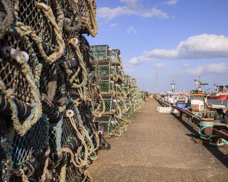 Lobster and Crab pots stacked on the quaysideの写真素材