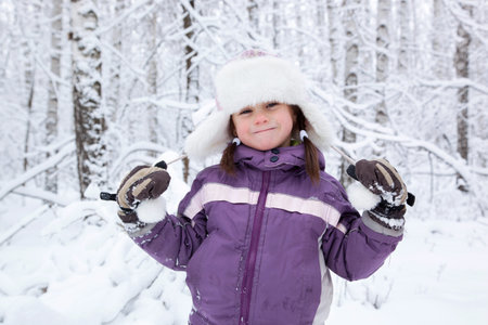 wonderful girl child in the snowy woods