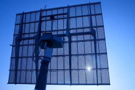 Solar Panels Silhouette Against Blue Skyの写真素材