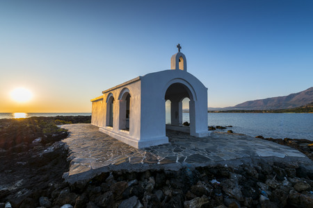 Small White Church By Sunrise in Georgioupolis, Crete, Greeceの写真素材