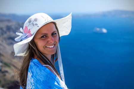 Beautiful Woman Enjoying The View Of The Wonderful Santorini, Greeceの写真素材