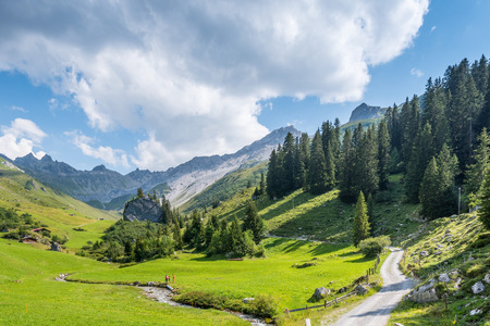 Beautiful Mounain Landscape in the Alps, in St. Antnien, Switzerlandの写真素材