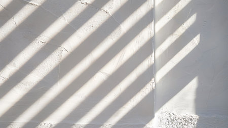 White wall with shadow from the window. Abstract background and texture for design.の素材