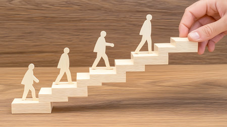 Businessman climbing a wooden ladder to success. Concept of success and growth.の素材