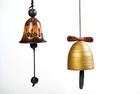 Clay bells hand made isolated on whiteの写真素材