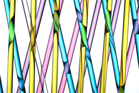 Close up of glass straws with coloured liquidsの写真素材