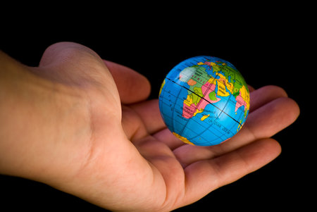 Close up of globe hanging above the palm