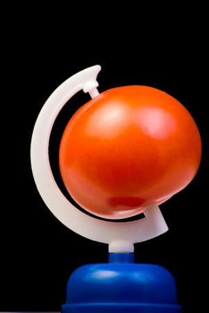 Globe from tomato on black backgroundの写真素材