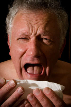 Close up of a man sneezingの写真素材
