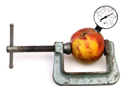 Apple with manometer in clampの写真素材