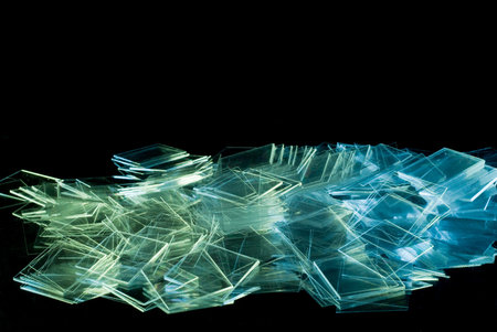 Spilled thin square shape glass isolated on black