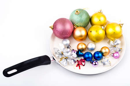 Various Christmas decorations on frying panの写真素材