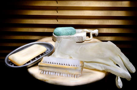Cleaning equipment on table with pleated blinds in backgroundの写真素材