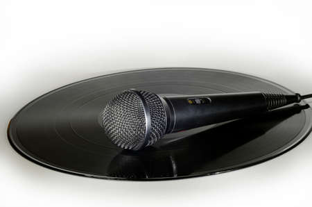 Microphone placed on a vinyl record albumの写真素材