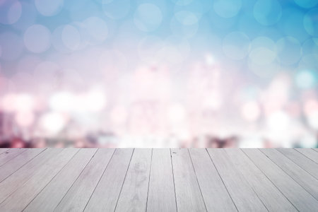 abstract blur cityscape background with wooden floor at night in bangkok