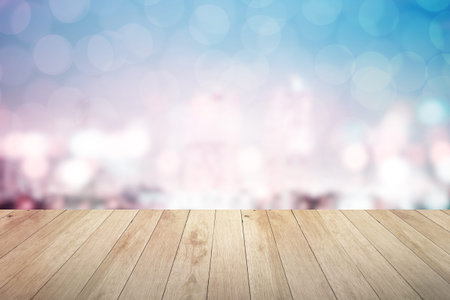 abstract blur cityscape background with wooden floor at night in bangkok
