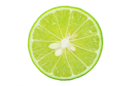 Abstract green background with citrus-fruit of lime slices. Close-up. Studio photography.