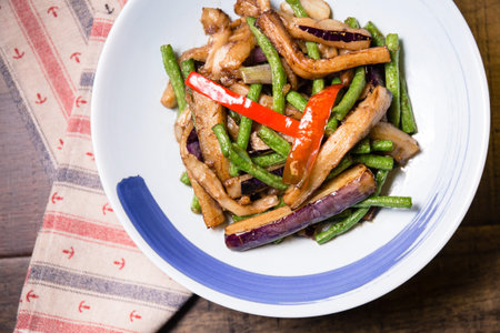 A plate of long beans and eggplantのeditorial素材