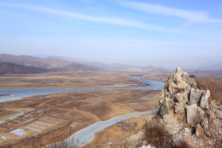 View from mountain top on  valley,  river and hillsの写真素材