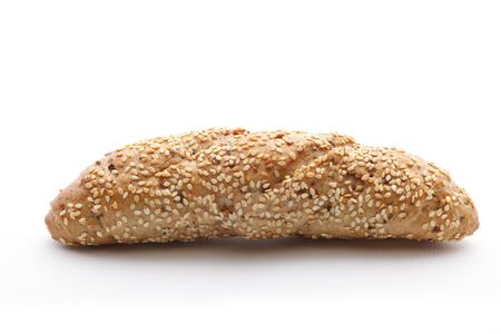 Homemade brown bread with cereals on white backgroundの写真素材