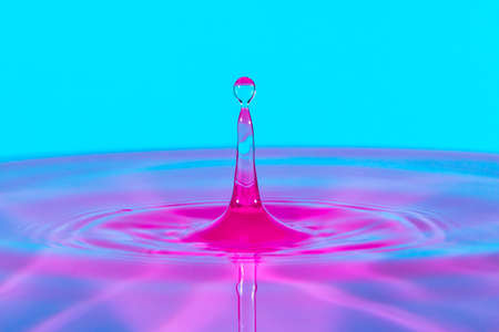 Water drop splash blue and pinkの写真素材