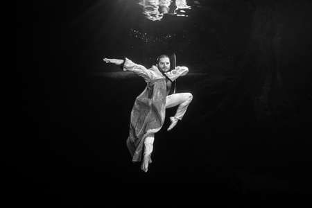 Young male ballet dancer unerwater
