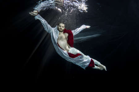 Young male ballet dancer unerwaterの写真素材