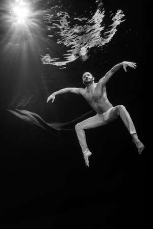 Young male ballet dancer unerwaterの写真素材