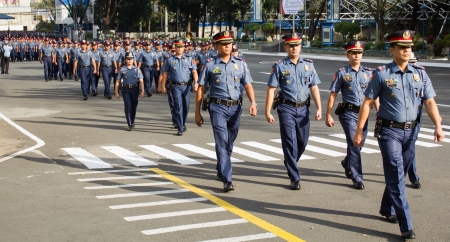 Quezon City, Philippines - January 28, 2013:The national police celebrated their 22nd founding anniversary in Camp Crame, the Head Quarters of the Philippine National Police in Manila during traditional Monday flag raising activity.のeditorial素材