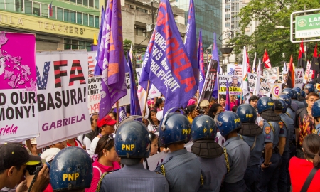 Manila, Philippines- March 8, 2013- Protest during International Womens Day celebration to opt out US military troops in the country.のeditorial素材