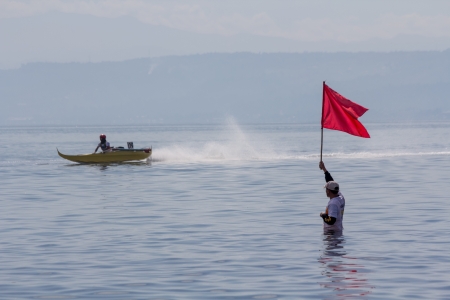 Cagayan De Oro City, Philippines - August 28, 2013  Thousands of spectators witnessed the racing of motorized wooden boats known as  Banca  sponsored by Bombo Radyo in Barangay Lapasan fronting Macajalar Bay during the culmination of the city fiesta のeditorial素材