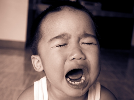 Baby boy cryingの写真素材