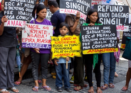 Manila, Philippines- November 9, 2013  Protesters lead by the group Gabriela and Anakpawis stormed the offices of the Energy Regulatory Commission in Manila to demand that it investigate Meralco, the country largest electricity distributor のeditorial素材