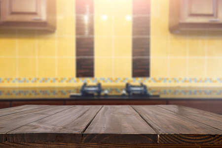Wood desk space and blurred of kitchen background. for product display montage. business presentation.の写真素材