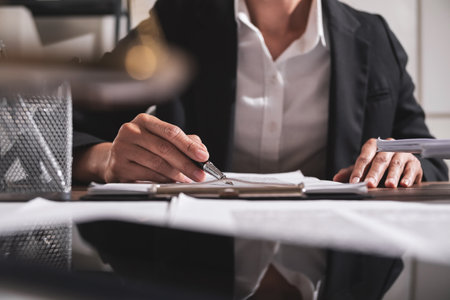 Business woman hand analyze chart paper. Business and technology conceptの写真素材