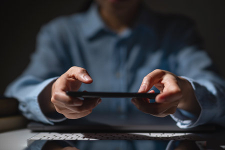 A man using smartphone watching media or playing a gameの写真素材