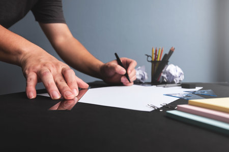 Man hands working with tools sketching draw a line on empty white paperの写真素材