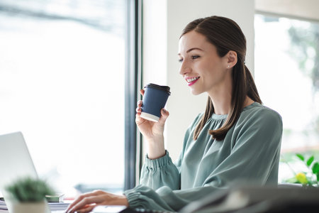 Businesswoman enjoy working with coffee at work place,relax happy. business concept.の写真素材