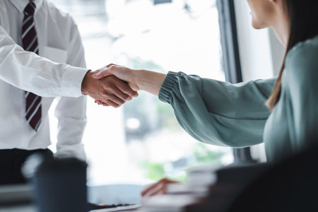 Business people shaking hands, finishing up a meeting.の写真素材