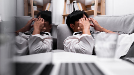 Businessman stressed lying on the sofa.の写真素材