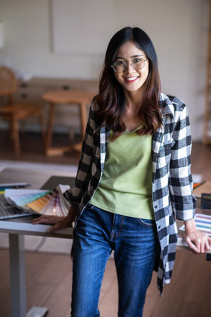 Portrait of female graphic designer in officeの写真素材