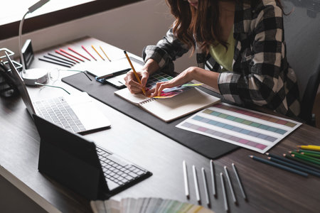 Graphic designer working with sketching logo design at office