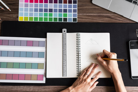 Graphic designer working with sketching logo design at office